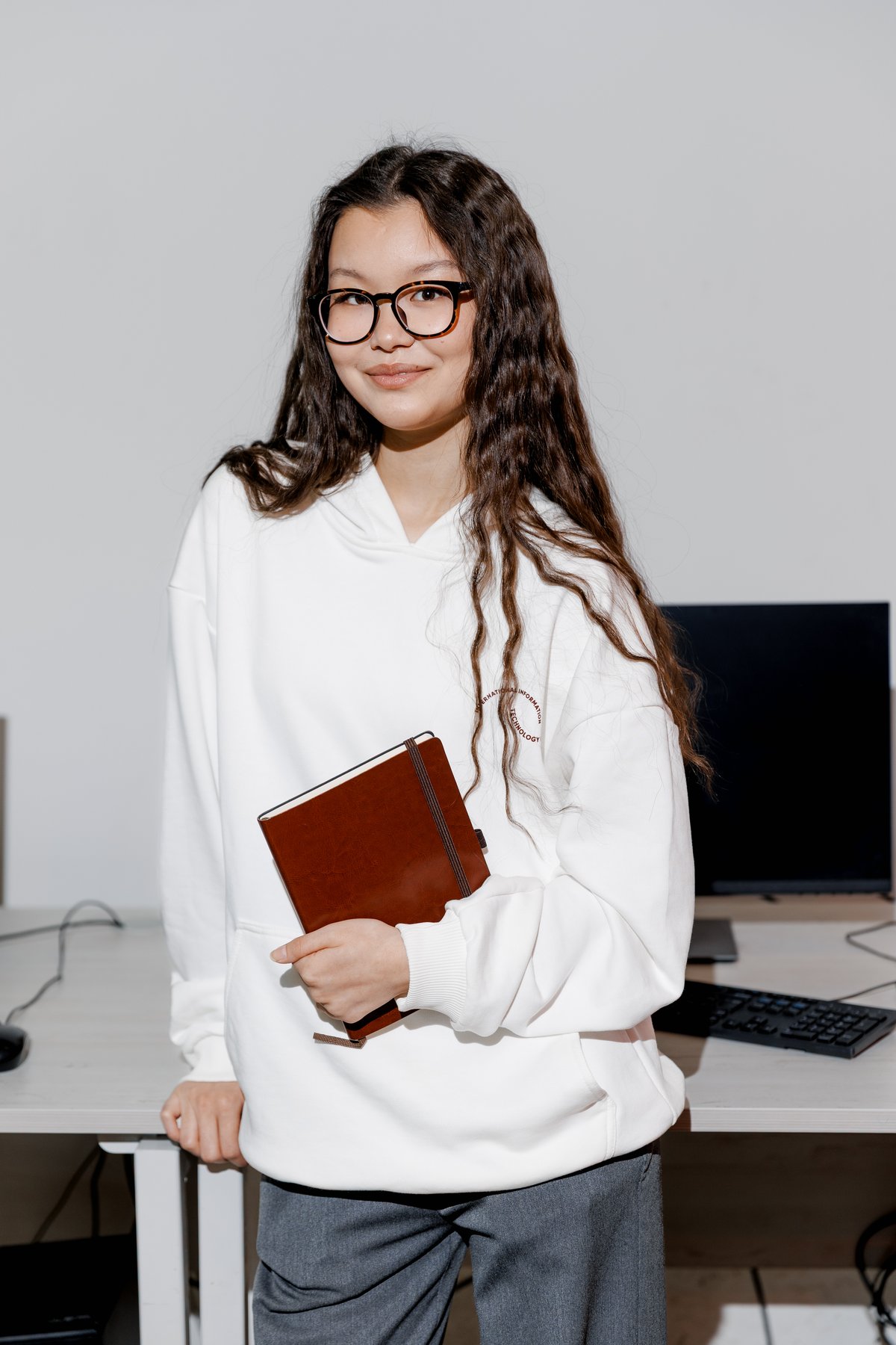 Natural Intelligence Creating Artificial Intelligence: How IITU Graduates Use AI in Arqa, Aqyl Battle, and 1FIT
